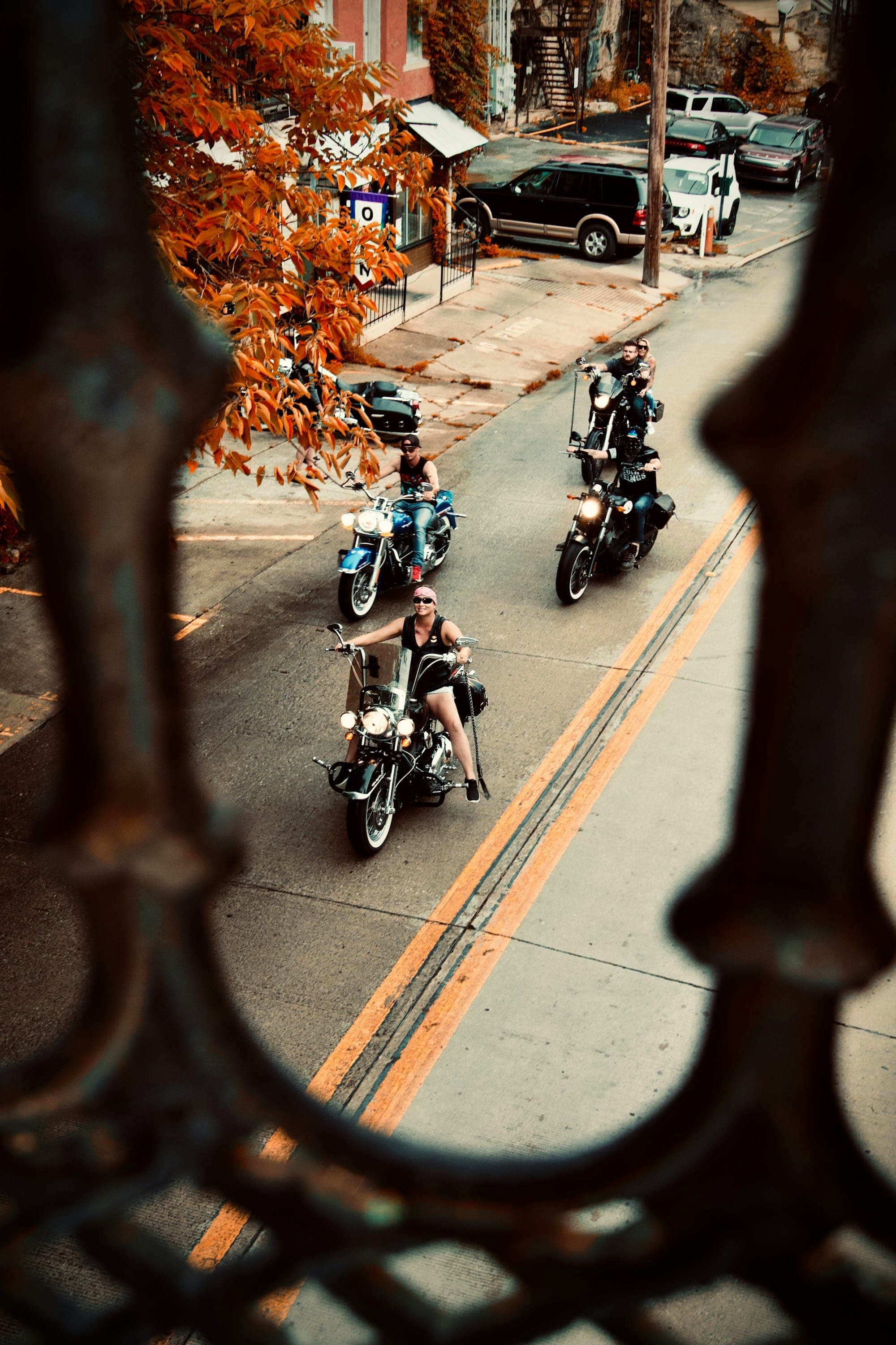 Riders on cruisers rolling down the Victorian main street of Eureka Springs, Arkansas