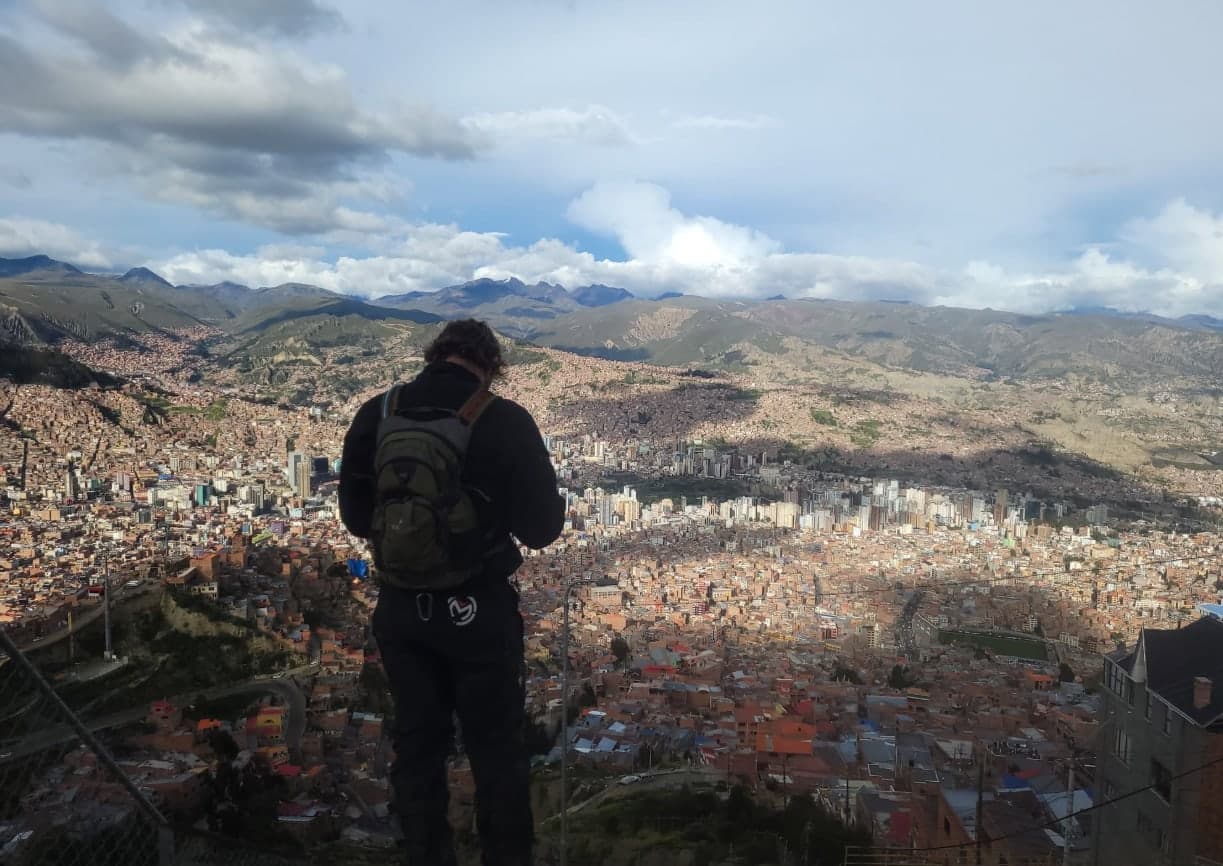 Ross looking out over the whole bowl of La Paz from the rim at El Alto