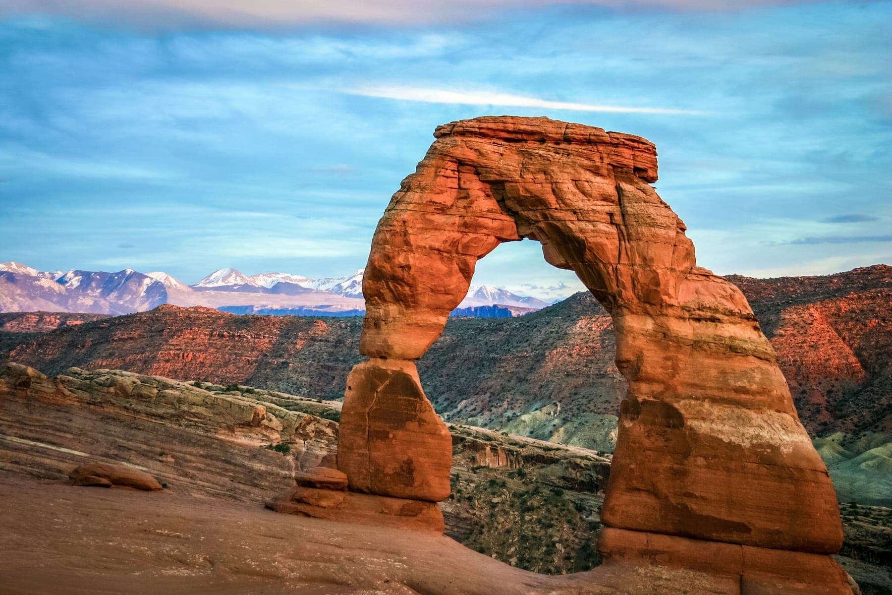 Delicate Arch with the snow-capped La Sal Mountains behind it