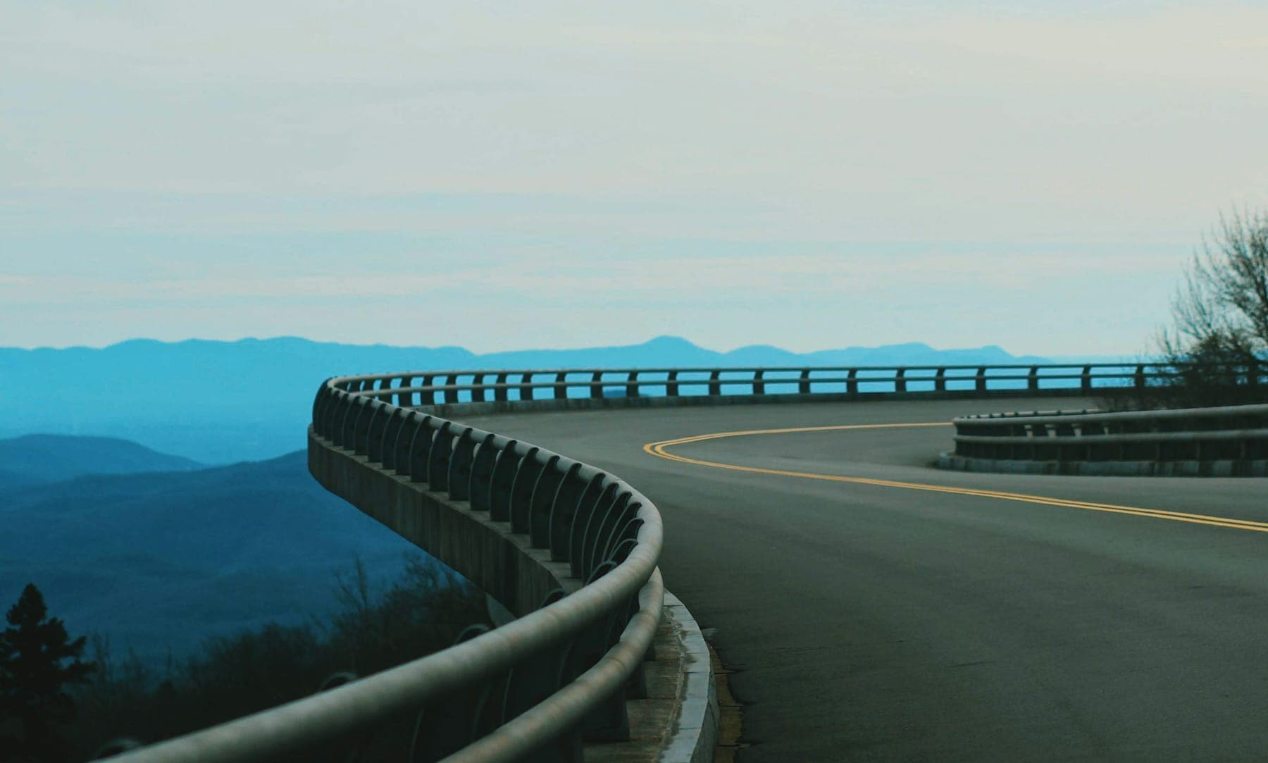 The Blue Ridge Parkway curving along a ridge with mountains behind