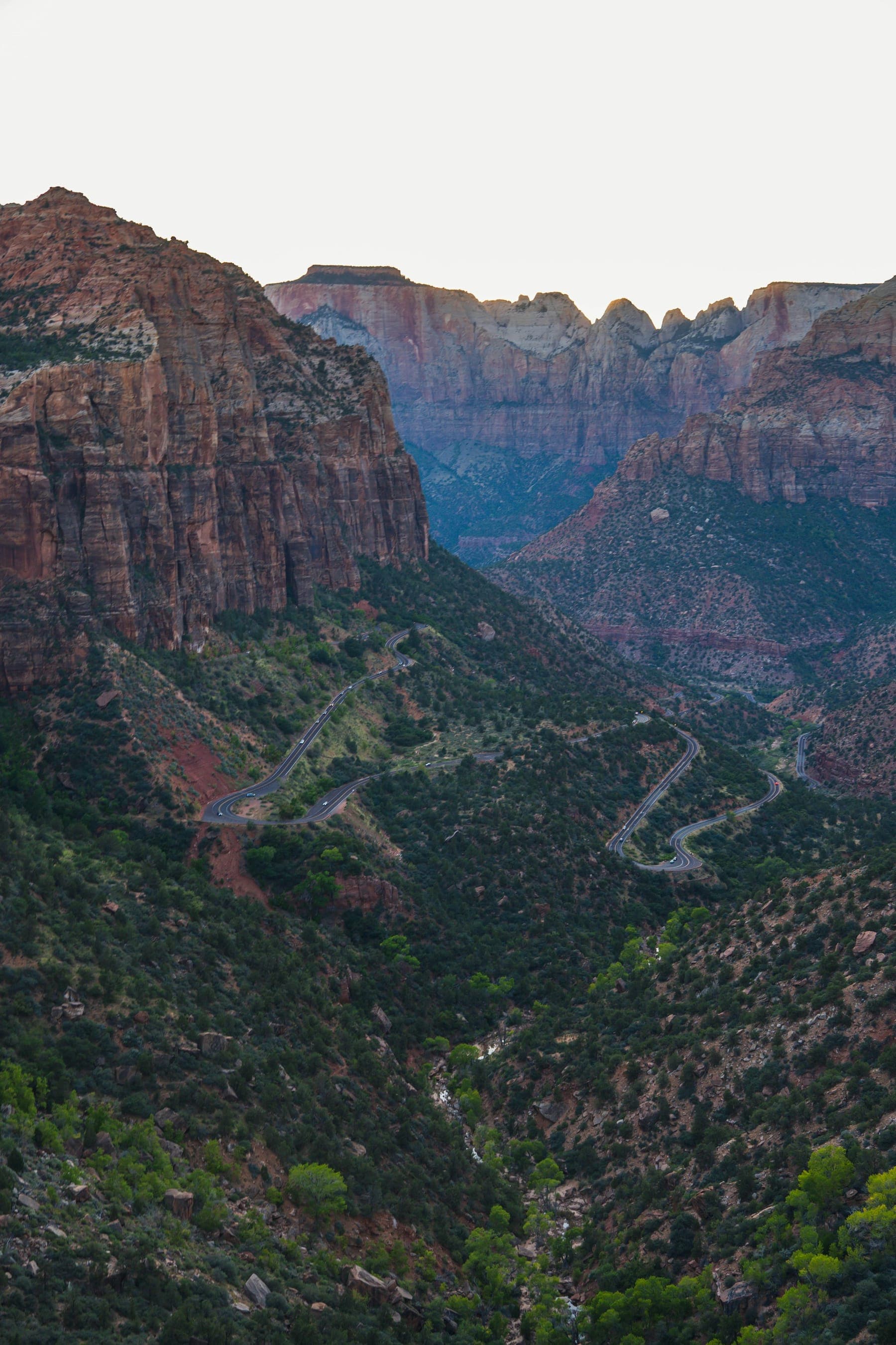 The Zion-Mount Carmel Highway switchbacking down the canyon wall at dusk